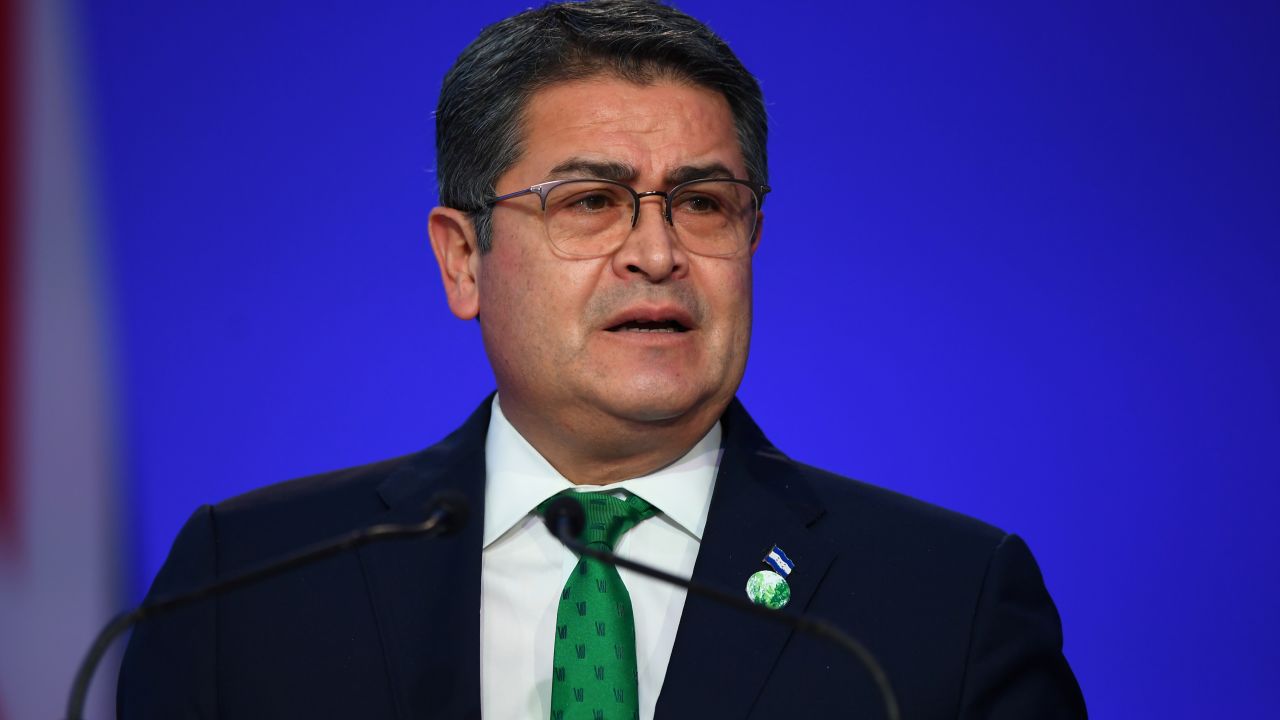 Honduras' President Juan Orlando Hernandez presents his national statement as a part of the World Leaders' Summit at the UN Climate Change Conference (COP26) in Glasgow, Scotland, on November 1, 2021.
