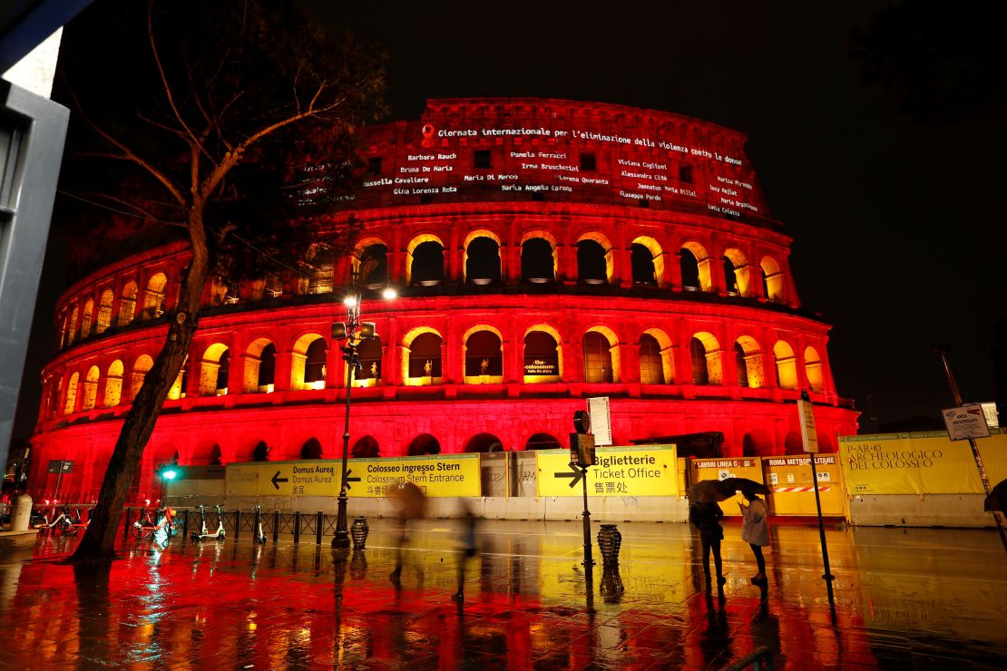 Names of femicide victims are projected onto the Colosseum lit up in red to honor women who have been killed by men to mark International Day for the Elimination of Violence Against Women, in Rome, Italy, on November 25, 2021.