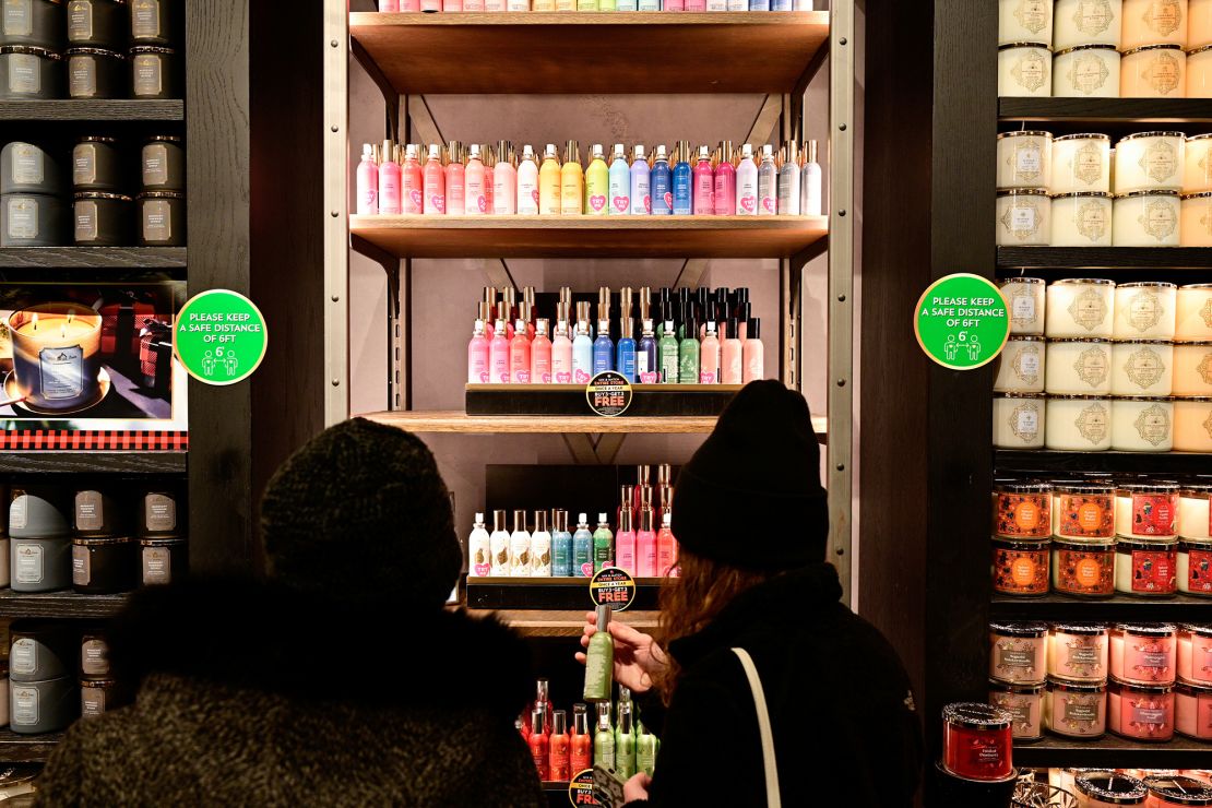 People shop in a Bath & Body Works store as Black Friday sales begin at The Outlet Shoppes of the Bluegrass in Simpsonville, Kentucky, on November 26, 2021.