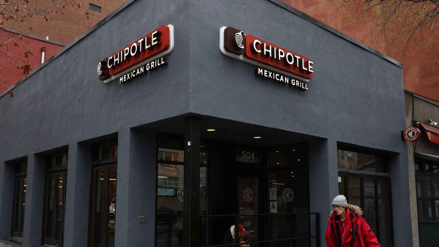 A person walks by a Chipotle outlet in Manhattan, New York City, U.S., February 7, 2022.