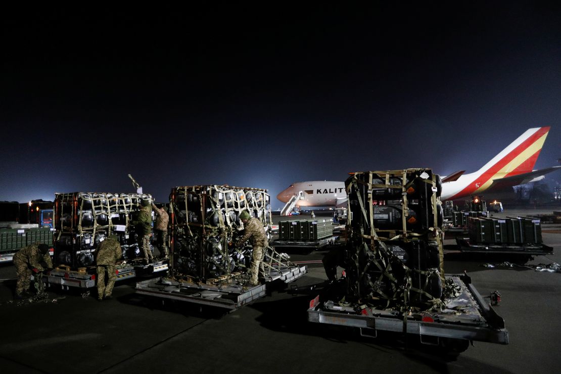 Ukrainian service members unpack Javelin anti-tank missiles, delivered by plane as part of the US military support package for Ukraine, on February 10, 2022.