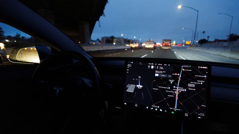 A Tesla Model 3 vehicle drives on autopilot along the 405 highway in Westminster, California, U.S., March 16, 2022.