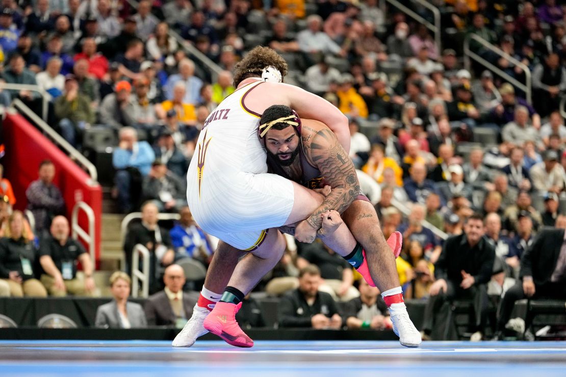 Minnesota wrestler Gable Steveson, right, wrestles Arizona State wrestler Cohlton Schultz in the 285 pound weight class final match during the NCAA Wrestling Championships at Little Cesars Arena.