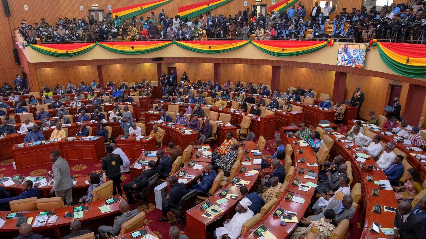 Parliamentarians and members of the public listen as Ghanaian President Nana Akufo-Addo delivers his annual state of the nation address on March 30, 2022.