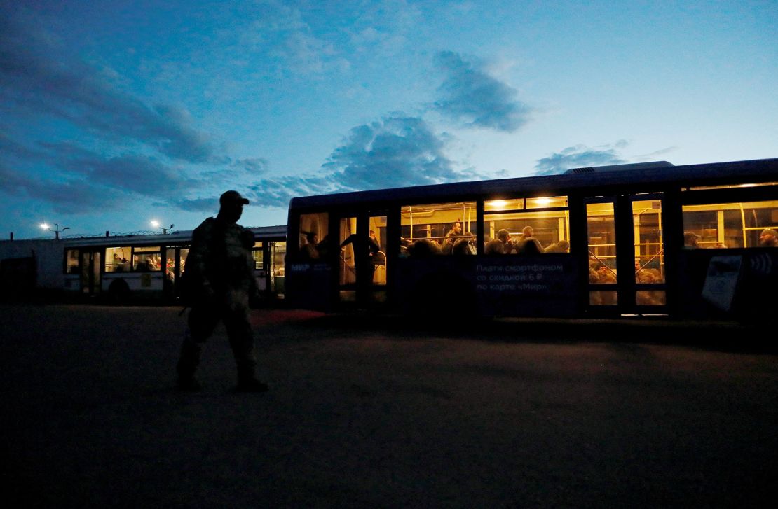 Ukrainian service members who surrendered after weeks holed up at the Azovstal steel works in Mariupol are seen inside a bus which arrived at a detention facility in Olenivka in Donetsk, May 17, 2022.