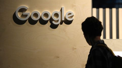 A woman passes the logo from the web search engine provider Google during the digital society festival 're:publica', at the Arena Berlin in Berlin, Germany June 9, 2022.