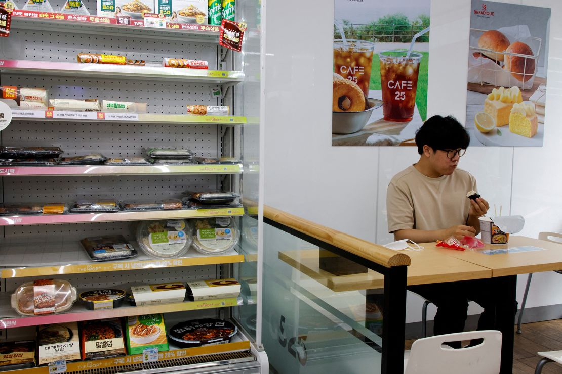 An office worker eats his lunch at a convenience store in Seoul, South Korea, on June 24, 2022.