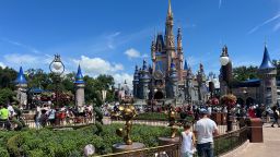 People gather ahead of the "Festival of Fantasy" parade at the Walt Disney World Magic Kingdom theme park in Orlando, Florida, U.S. July 30, 2022.