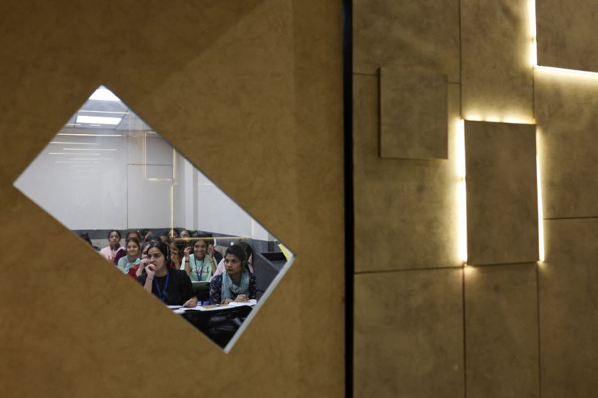 Students attend an International English Language Testing System (IELTS) class conducted by educational consultancy Western Overseas in Ambala, India.