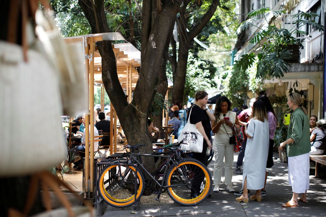 People talk in the Roma Norte neighborhood of Mexico City, on September 9, 2022.