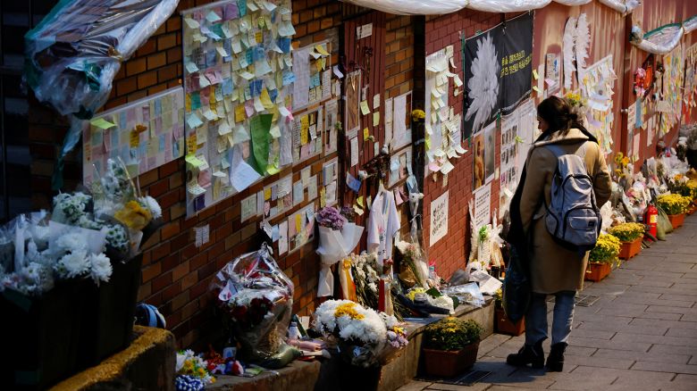 A woman mourns at the scene of a crowd crush that happened during Halloween festivities in Seoul, South Korea, November 29, 2022.