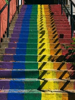 Rainbow painted stairs are seen in downtown Eureka Springs. - (A Progress Pride Flag flies in downtown Eureka Springs.)