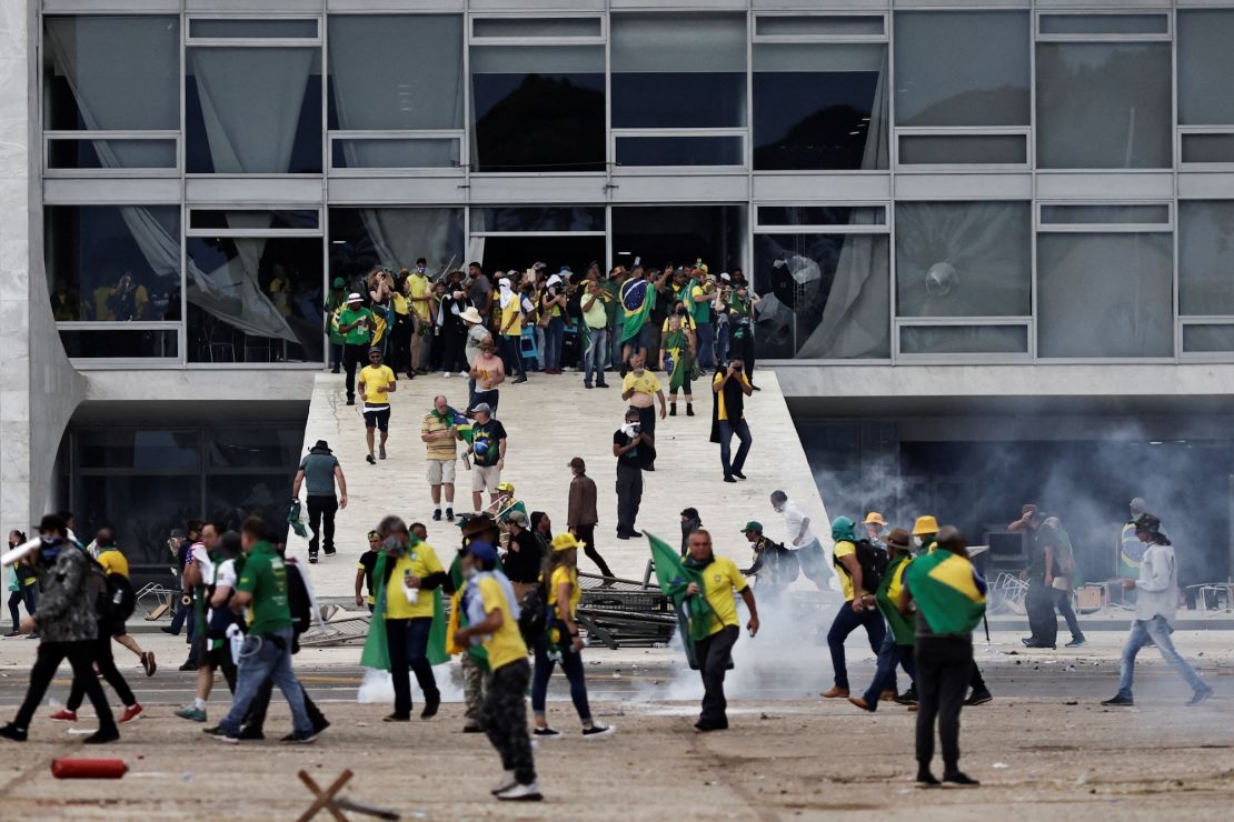 Supporters of Brazil's former President Jair Bolsonaro demonstrate against President Luiz Inacio Lula da Silva, outside the Planalto Palace in Brasilia on January 8, 2023.