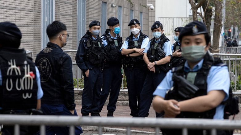 Police stand guard outside the West Kowloon Magistrates' Courts building during the hearing of the 47 pro-democracy activists charged with conspiracy to commit subversion under the national security law, in Hong Kong, China February 6, 2023. REUTERS/Tyrone Siu