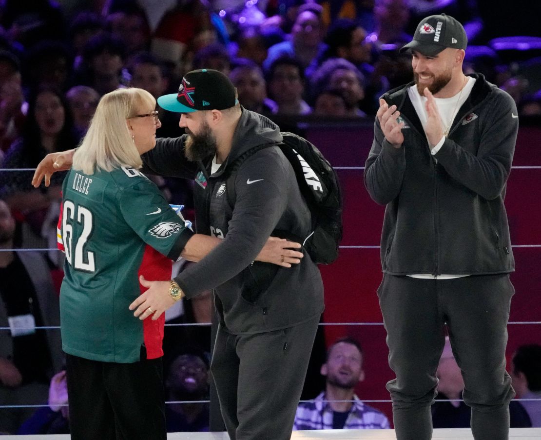 (From left) Donna Kelce, Jason Kelce and Travis Kelce at the 2023 Super Bowl Opening Night ceremony in Phoenix.