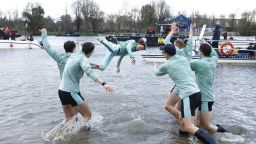 Rowing - University Boat Race - Oxford v Cambridge - River Thames, London, Britain - March 26, 2023
Cambridge coxswain Jasper Parish is thrown in the river by teammates after winning the men's race Action Images via Reuters/Andrew Boyers