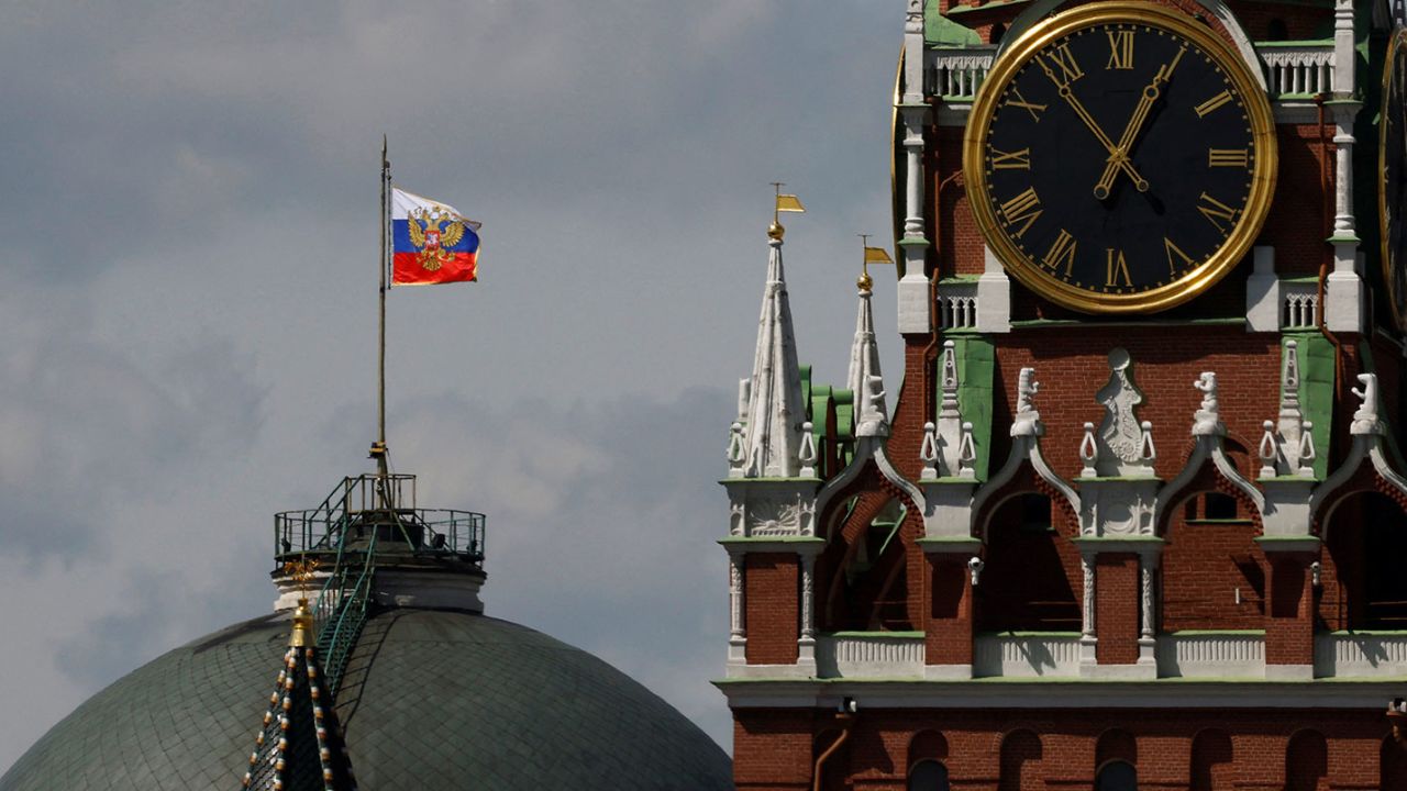The Russian flag flies on the dome of the Kremlin Senate building behind Spasskaya Tower, while the roof shows what appears to be marks from the recent drone incident, in central Moscow, Russia, May 4, 2023. REUTERS/Stringer