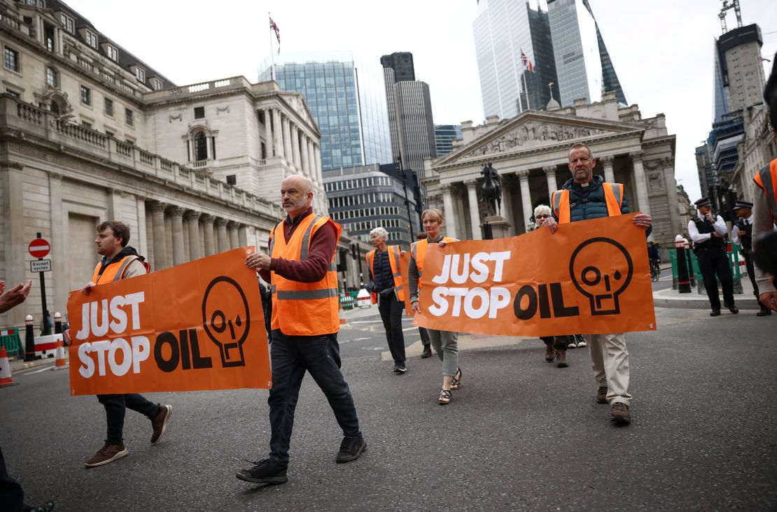 Activists from Just Stop Oil take part in a slow march along a road in the City of London financial district in London, Britain May 22, 2023. REUTERS/Henry Nicholls