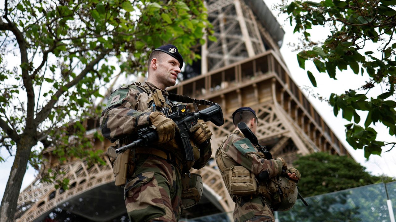 French soldiers patrol near the Eiffel Tower as part of the "Sentinelle" security plan in Paris, France, May 23, 2023. REUTERS/Benoit Tessier     TPX IMAGES OF THE DAY     