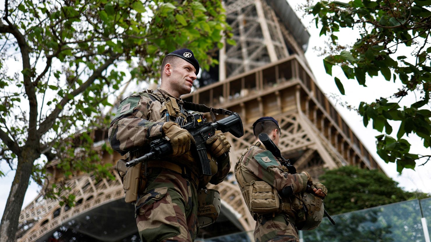 French soldiers patrol near the Eiffel Tower as part of the "Sentinelle" security plan in Paris.