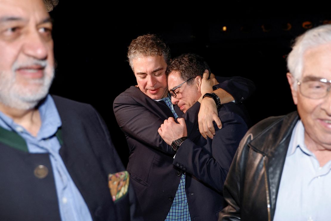 Family members embrace Siamak Namazi and the other freed Americans as they arrive back in the United States on September 19, 2023.