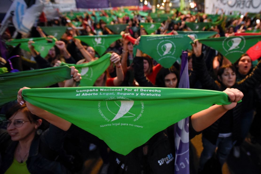 People hold green handkerchiefs during a demonstration in support of safe and legal abortion access to mark International Safe Abortion Day, in Buenos Aires, Argentina, September 28, 2023.