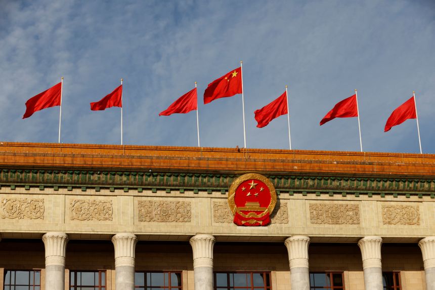 A Chinese flag flutters on top of the Great Hall of the People ahead of the opening ceremony of the Belt and Road Forum (BRF), to mark 10th anniversary of the Belt and Road Initiative, in Beijing, China October 18, 2023.