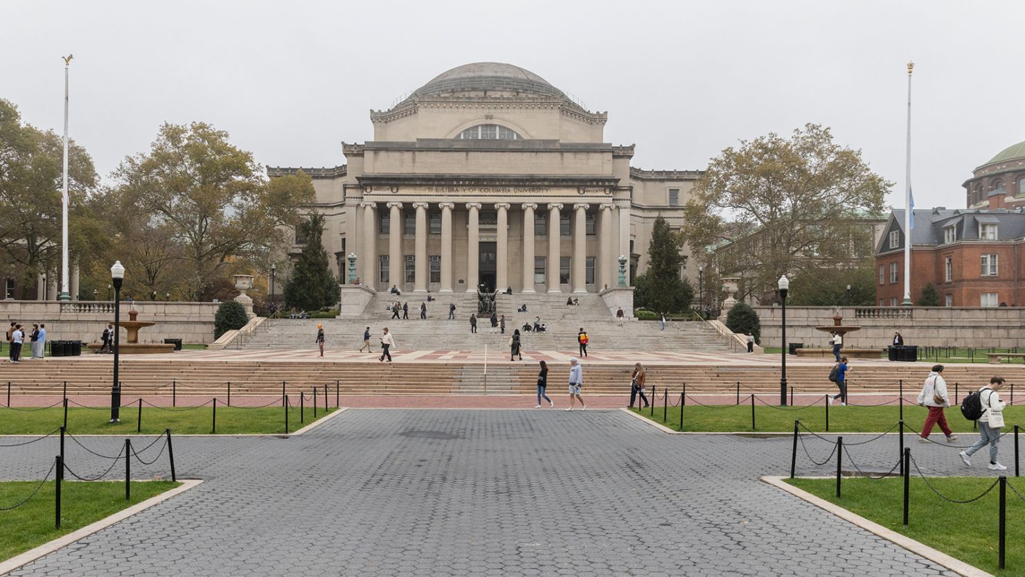 People walk past Columbia University in New York, U.S., October 30, 2023.