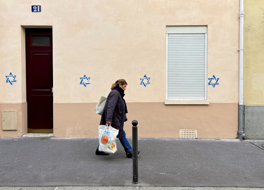Passing a building tagged with David's star in Paris on October 31, 2023.