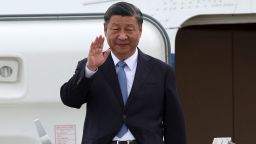 Chinese leader Xi Jinping waves as he arrives at San Francisco International Airport on November 14, 2023.