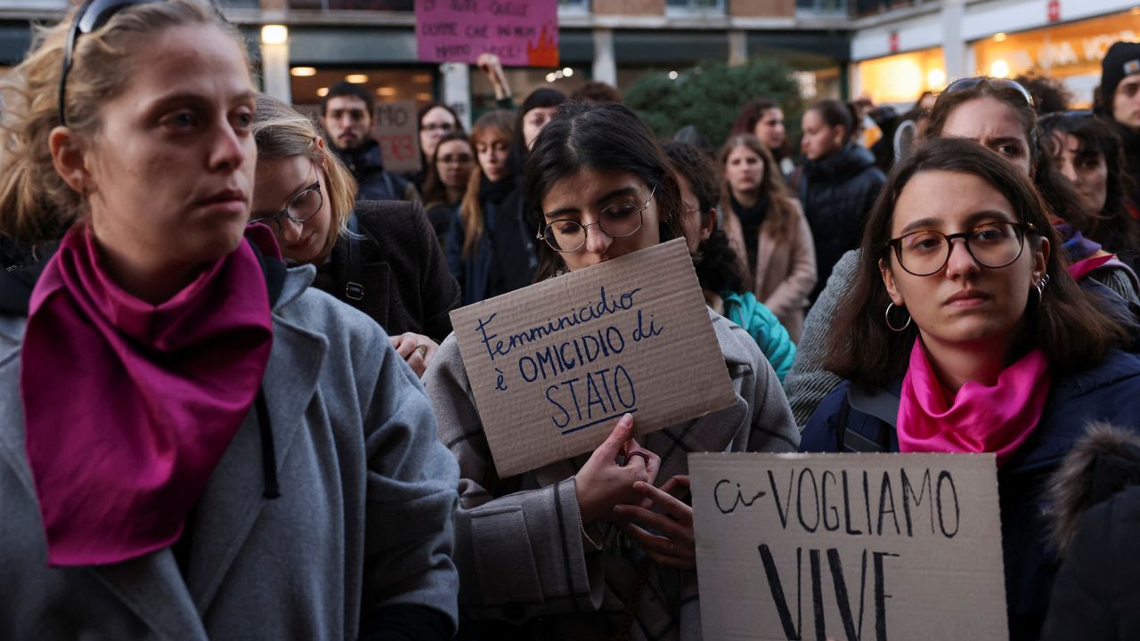 Students hold banners reading "Femincide is a state murder" and "We want us alive" as they perform a flash mob to protest against feminicide and violence against women, following 22-years-old Giulia Cecchettin's murder, outside University of Milan, in Milan, Italy, November 22, 2023. REUTERS/Claudia Greco
