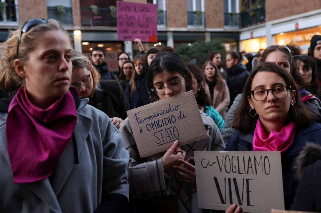 Students hold banners reading "Femicide is a state murder" and "We want us alive" outside the university of Milan on November 22, following 22-years-old Giulia Cecchettin's murder.