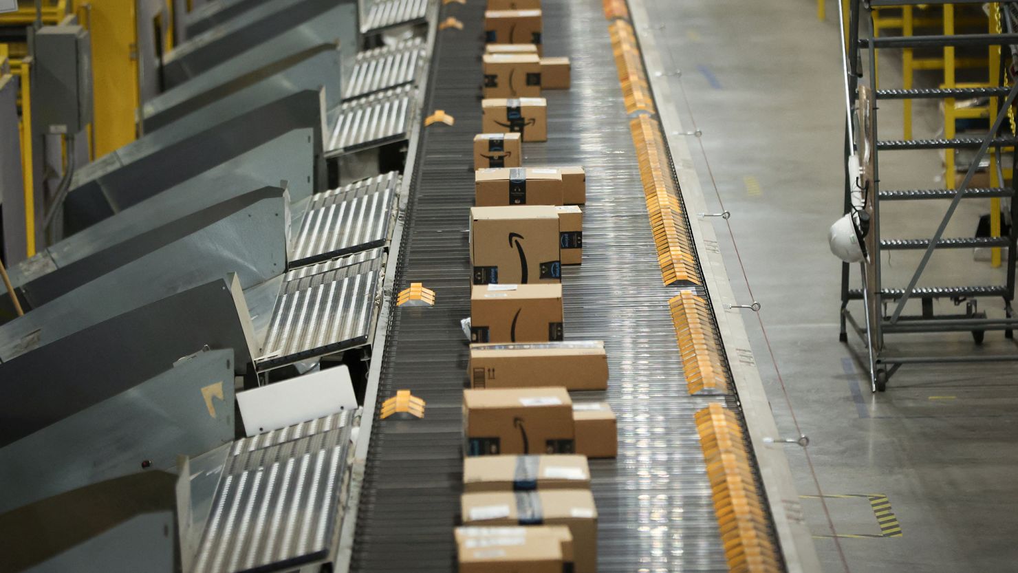 Packages travel on a conveyor during Cyber Monday at the Amazon's fulfillment center in Robbinsville, New Jersey, U.S., November 27, 2023.