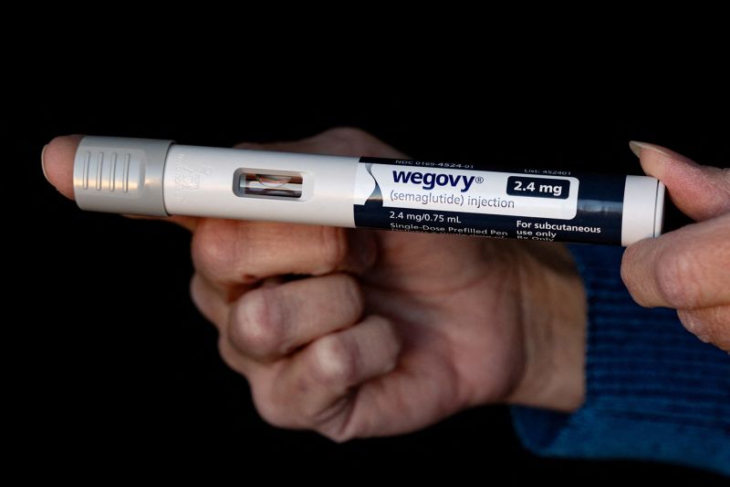 Rebekah Carl poses with her prescription of Wegovy in New Columbia, Pennsylvania, U.S., November 13, 2023. Photo taken on November 13, 2023. REUTERS/Hannah Beier