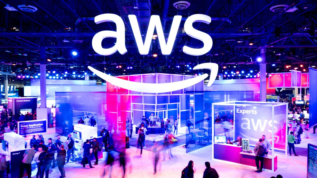 Amazon Web Services logo is displayed at a conference. The service went down for several hours Monday.