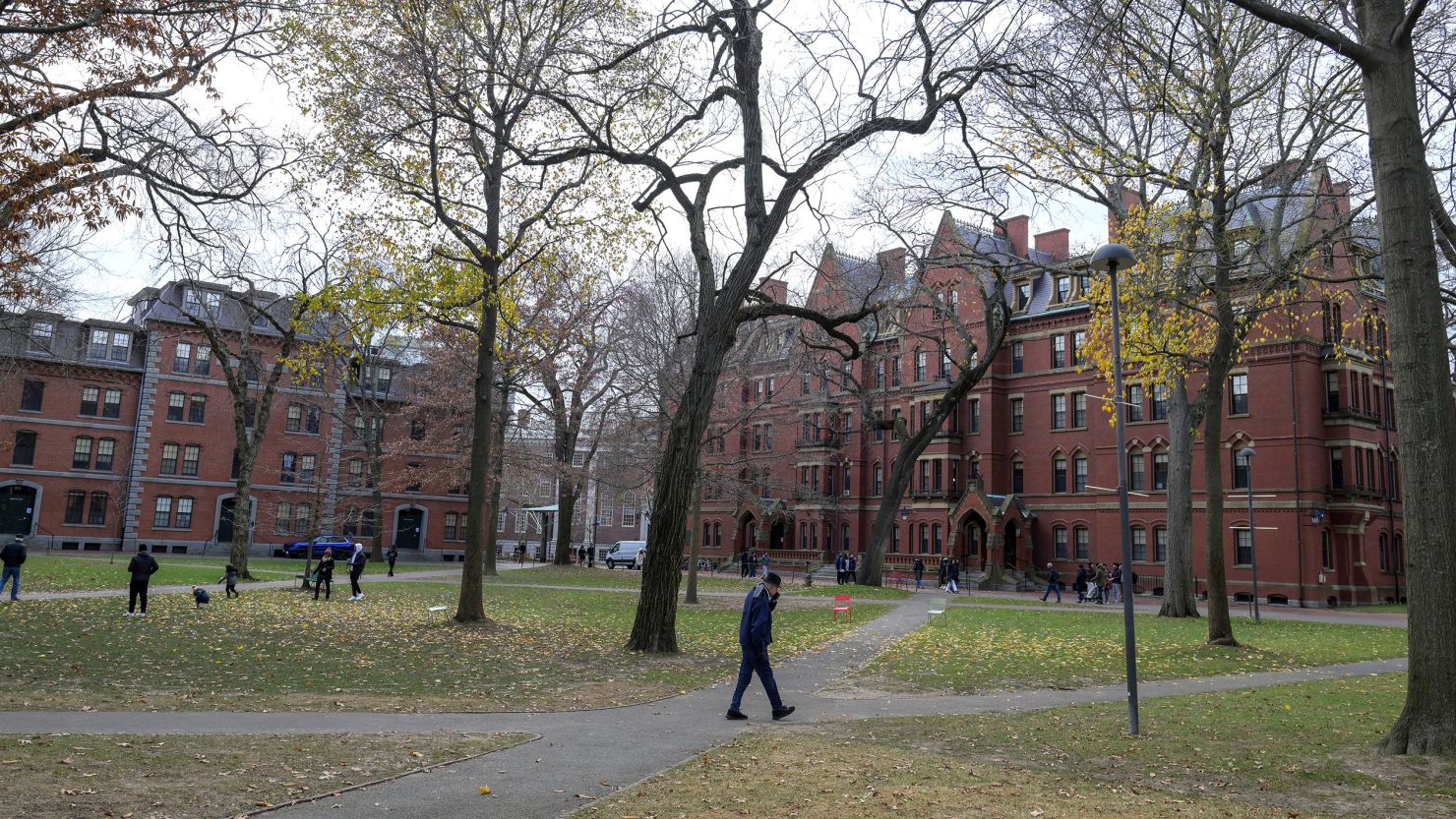 A man walks through Harvard yard at Harvard University in Cambridge, Massachusetts.