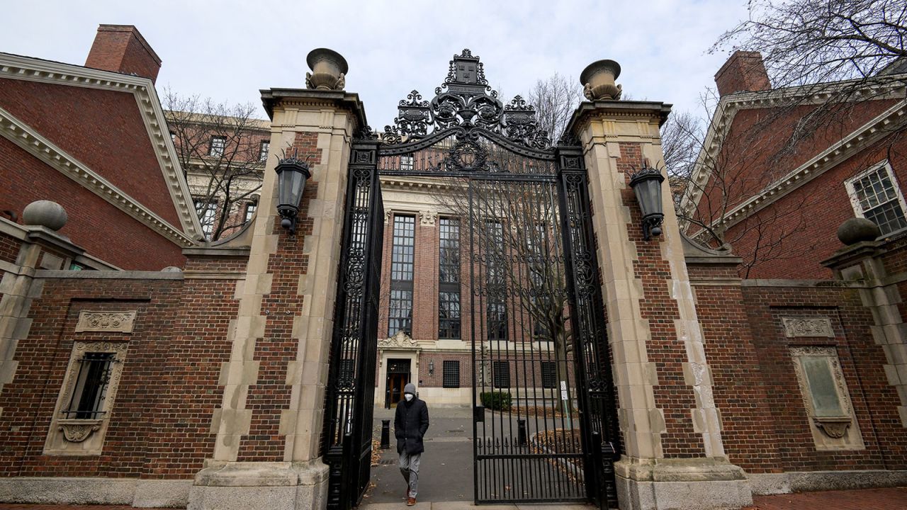 An unidentified person walks through Harvard yard at Harvard University in Cambridge, Massachusetts, U.S., December 7, 2023 as leaders of various universities come under fire from their schools' Jewish communities for their handling of clashes between pro-Israel and pro-Palestinian contingents since Hamas' October 7 attack on Israel.  REUTERS/Faith Ninivaggi