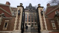 An unidentified person walks through Harvard yard at Harvard University in Cambridge, Massachusetts, U.S., December 7, 2023 as leaders of various universities come under fire from their schools' Jewish communities for their handling of clashes between pro-Israel and pro-Palestinian contingents since Hamas' October 7 attack on Israel. REUTERS/Faith Ninivaggi