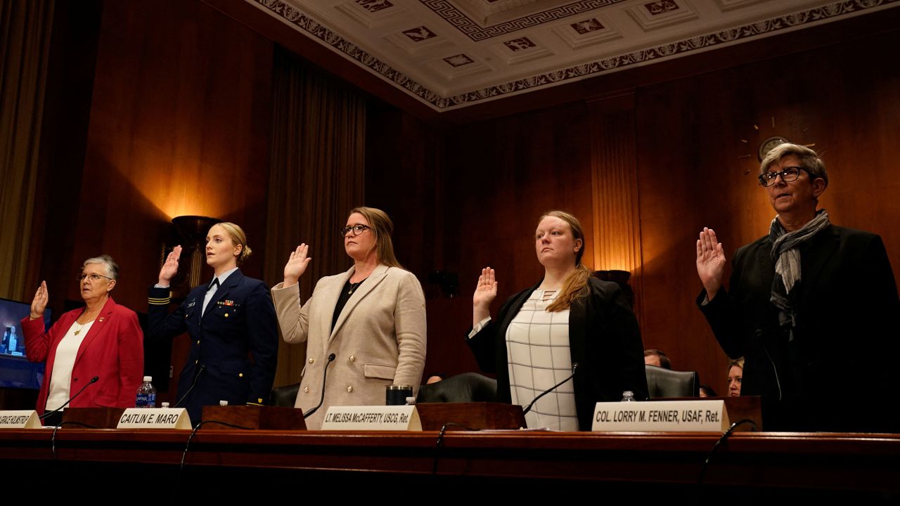 Retired U.S. Coast Guard Cmdr. Jennifer Yount, First Class Cadet Kyra Holmstrup of the Coast Guard Academy Class of 2024, former member of the Coast Guard Academy Class of 2008 Caitlin Maro, Retired Coast Guard Lt. Melissa McCafferty, and director of government affairs for the Service Women's Action Network retired U.S. Air Force Col. Lorry Fenner are sworn in during a U.S. Senate Homeland Security and Governmental Affairs Investigations Subcommittee hearing on "Coast Guard Academy Whistleblowers: Stories of Sexual Assault and Harassment," on Capitol Hill in Washington, U.S., December 12, 2023.