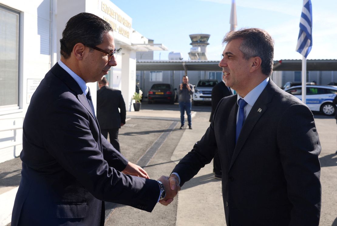 Cyprus' Foreign Minister Constantinos Kombos welcomes his Israeli counterpart Eli Cohen in Larnaca, Cyprus, on December 20.