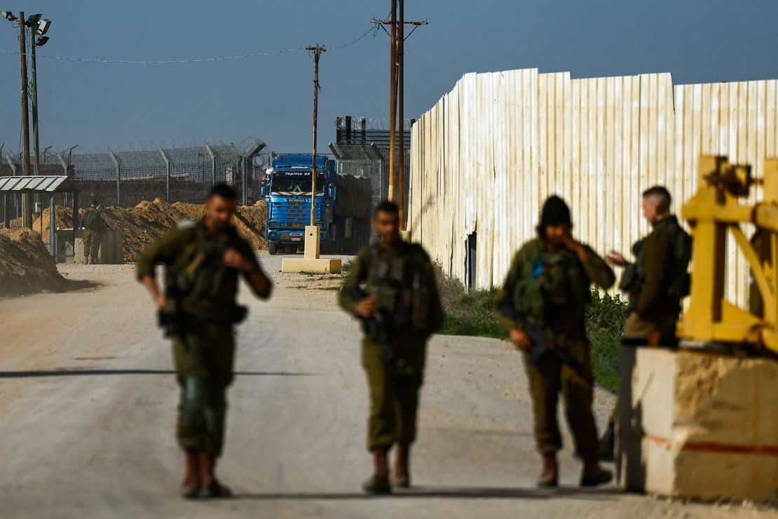 An aid truck enters from Egypt en route to Gaza as seen from the Kerem Shalom crossing in Israel on December 22, 2023.