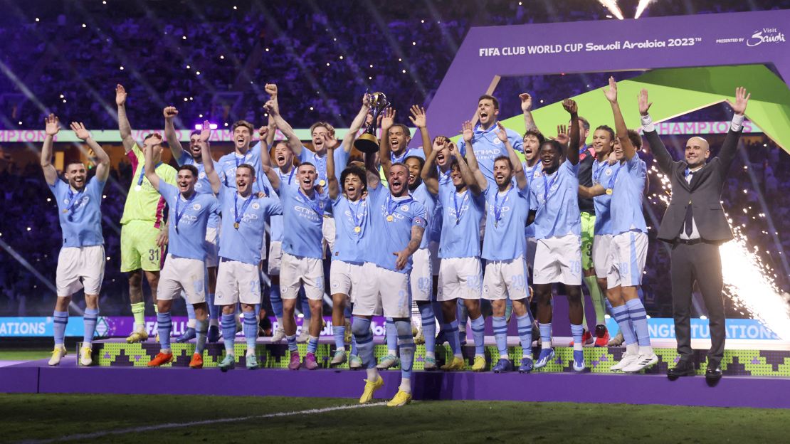 Manchester City hoist the Club World Cup trophy in December 2023.
