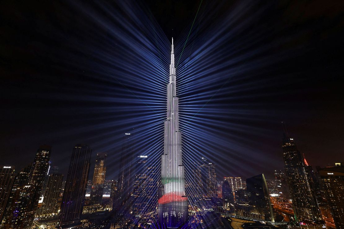 The colors of the United Arab Emirates flag are projected onto the Burj Khalifa, the tallest building in the world, during New Year's Eve celebrations in Dubai on December 31, 2023.