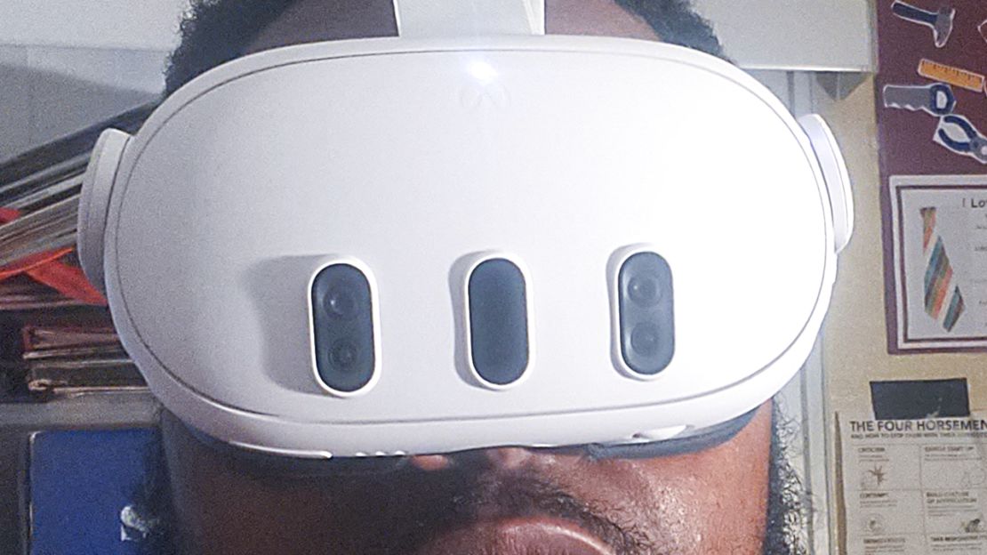 A person is wearing the Meta Quest 3 virtual reality headset.