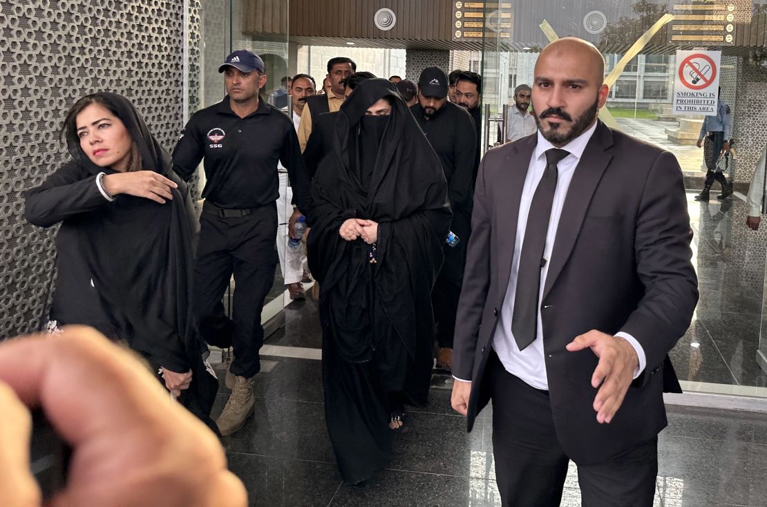 Bushra Bibi (center), wife of Imran Khan, leaves after a hearing of the bail case of Khan, at the High Court in Islamabad, Pakistan, in October 2023.