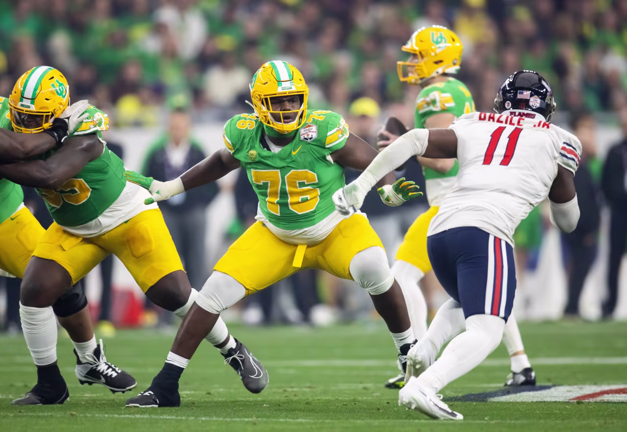 Oregon's Josh Conerly Jr. tries to keep the pocket clean during the Fiesta Bowl matchup against Liberty in January 2024.