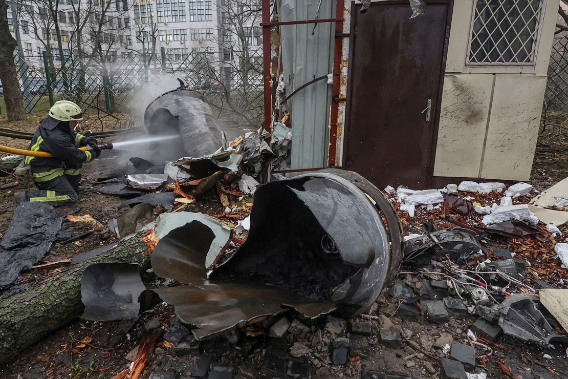 A firefighter extinguishes remains of an unidentified missile, which Ukrainian authorities claimed to be made in North Korea, at a site of a Russian strike in Kharkiv, Ukraine this past January.