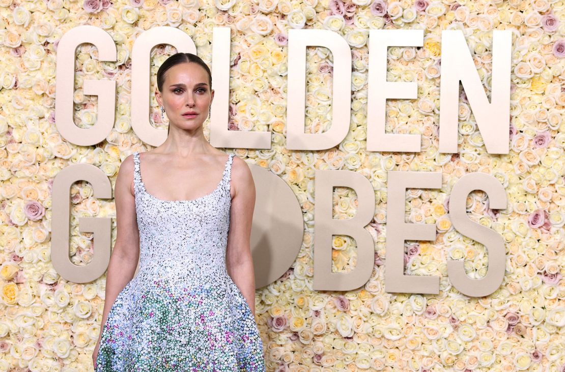 Natalie Portman wore a sequined floral masterpiece by Dior Haute Couture, Jimmy Choo shoes and De Beers diamond earrings and eternity band.