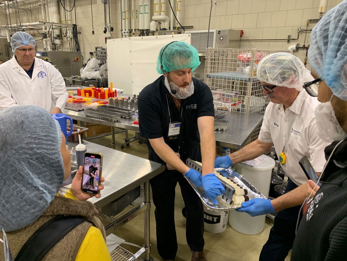 Ice cream novelties are created during a freezing class taught by Ice Cream Equipment Specialists Evan Waldt (center), Penn State’s Ph.D. Professor and Head of Food Science Dr. Bob Roberts (left) and Penn State's Dairy Products Processor manager Terry Grove (right).