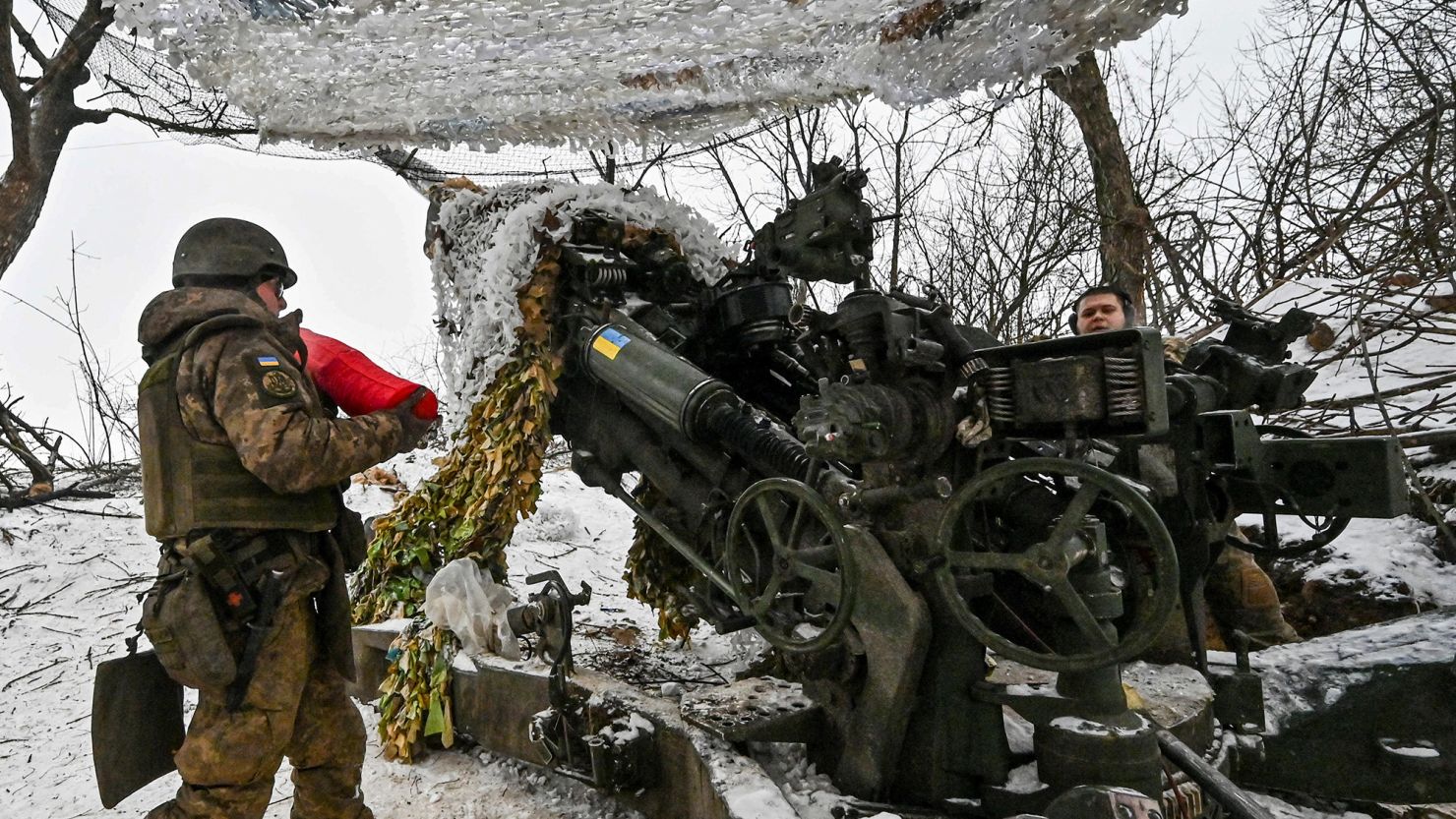 Ukrainian servicemen prepare a M777 howitzer to fire toward Russian troops at a position near a front line, in the Zaporizhzhia region, Ukraine, on January 14, 2024. REUTERS/Stringer
